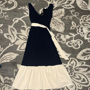 DKNY maxi dress. Navy and cream. Size 4. NWT. Zips in the back. Stretchy.